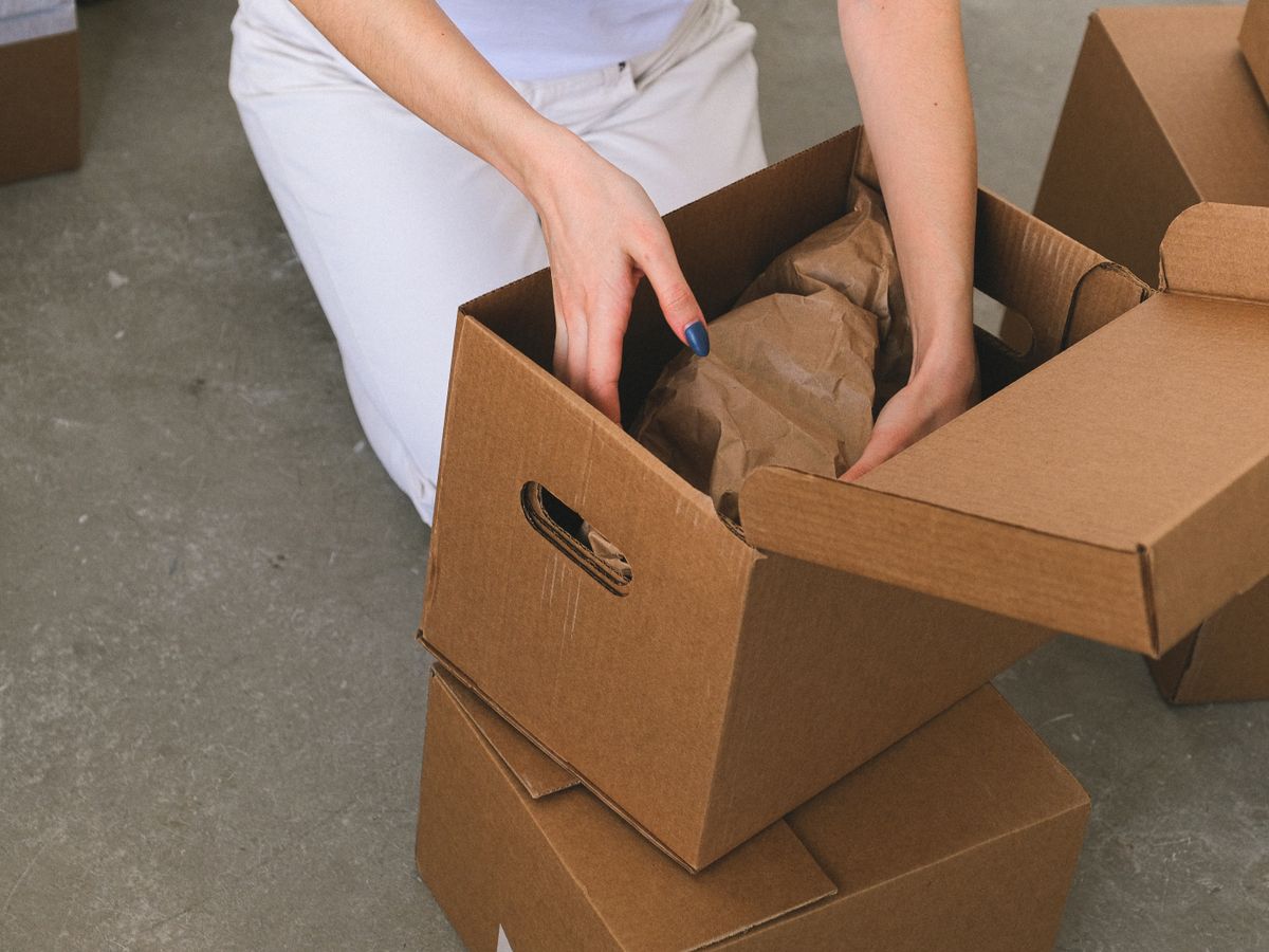 Boxes being carried out during a household cleanout