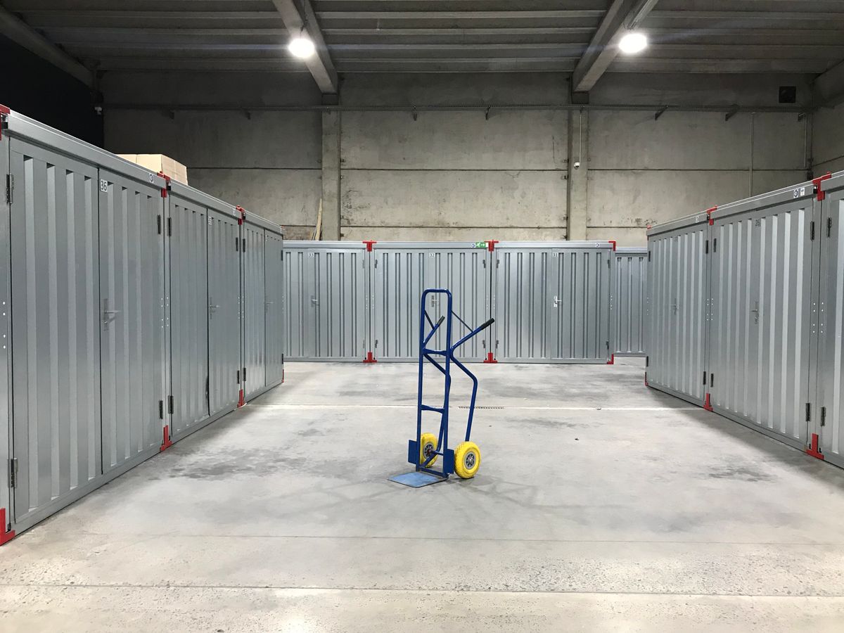 A row of self storage units with roll up doors